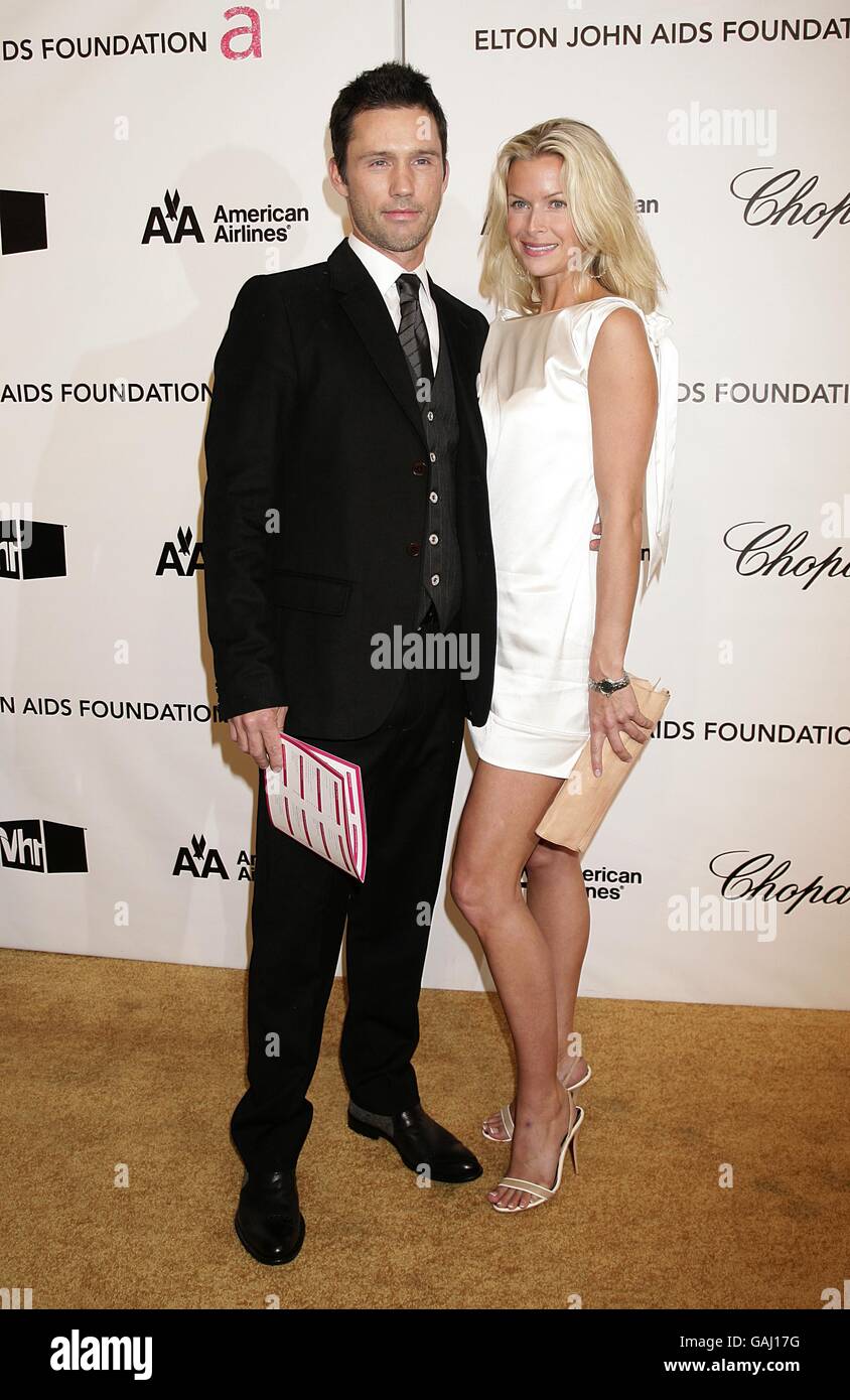 Jeffrey Donovan (left) and guest arrive for the 16th Annual Sir Elton John AIDS Foundation Oscar Party at the Pacific Design Centre in Los Angeles. Stock Photo