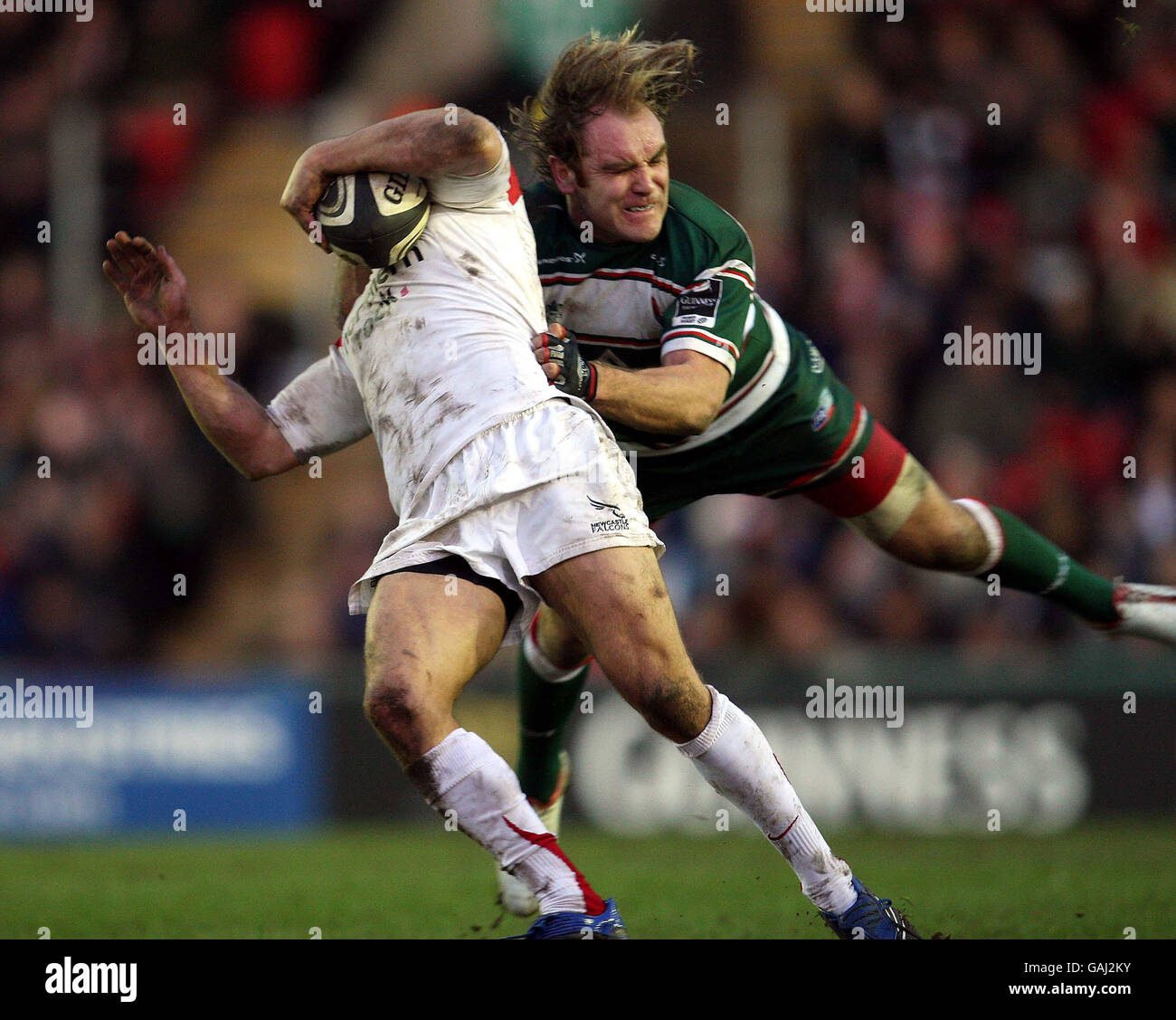 Leicester Tigers Andy Goode high tackles Newcastle Falcons Jonny Wilkinson during the Guinness Premiership match at Welford Road, Leicester Stock Photo