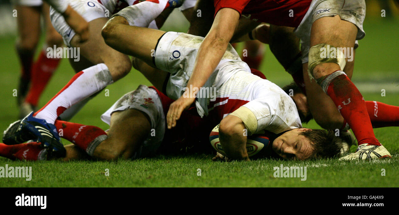 England's Jonny Wilkinson finds himself face down in the mud Stock Photo