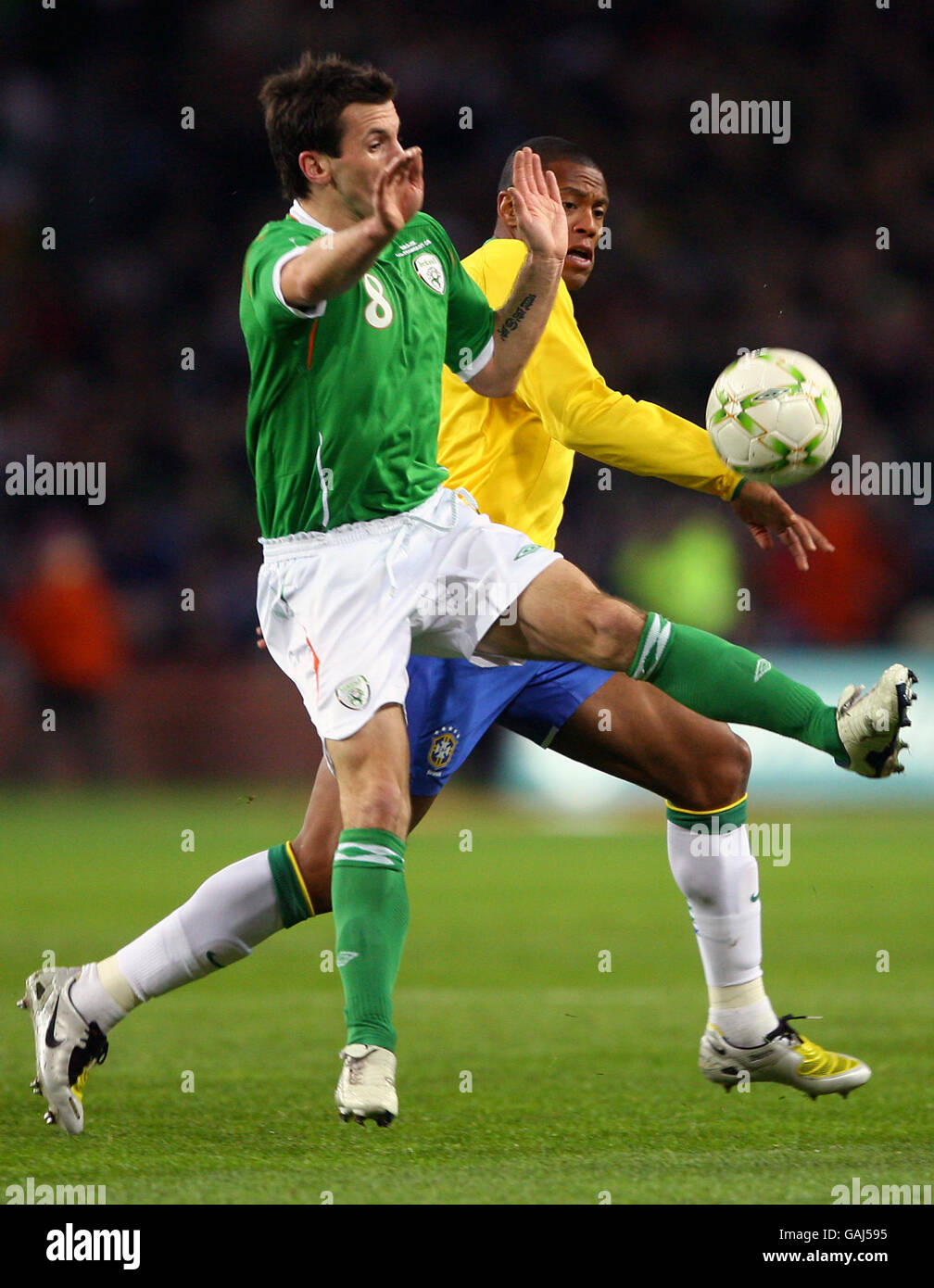 Soccer - International Friendly - Republic of Ireland v Brazil - Croke Park. Republic of Ireland's Liam Miller and Brazil's Julio Baptista Stock Photo