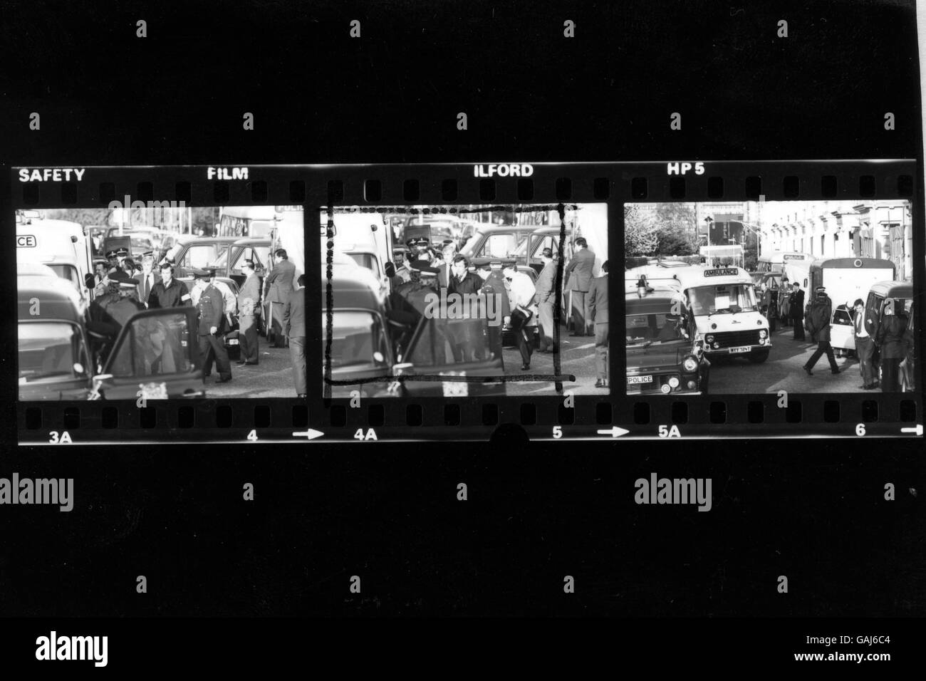 Contact Sheet. The body of a man on a stretcher being put into an ambulance near the Iranian Embassy after being brought from the the building on the sixth day of the siege. Shortly afterwards a huge explosion rocked the building. Stock Photo