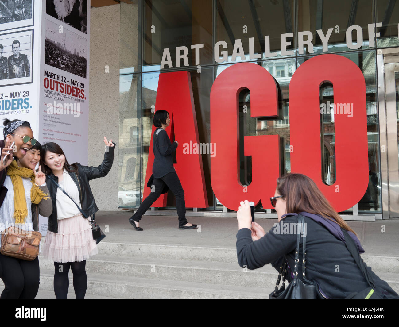 Exterior view of AGO Toronto. Tourists taking photographs. Art Gallery of Ontario is among the most distinguished art museums in North America. Stock Photo