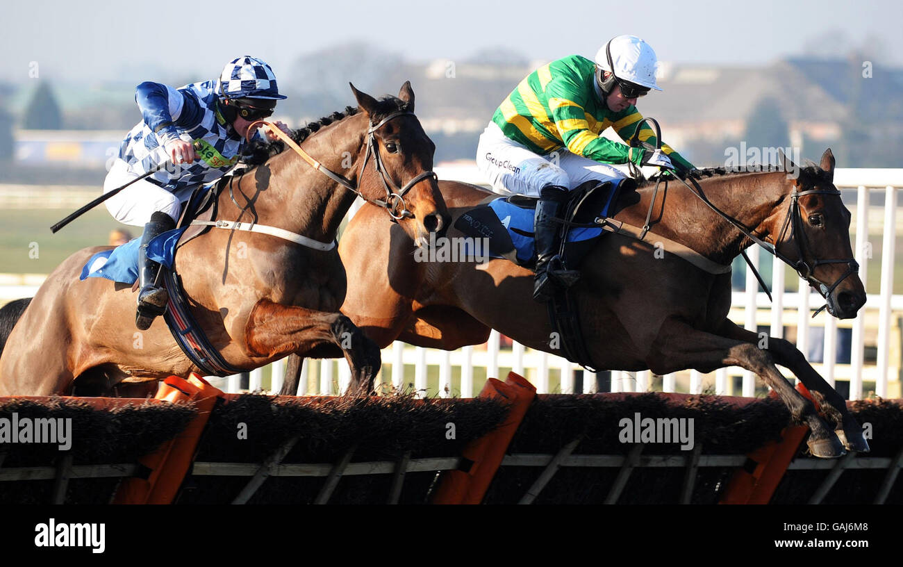 Runthatpastmeagain ridden by Noel Fehily (right) jumps the last ahead of Crop Walker ridden by Richard McGrath to win the Jabra GN and Rocom Maiden Hurdle at Wetherby Racecourse. Stock Photo