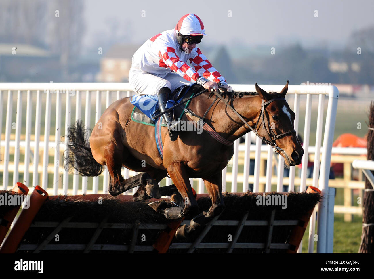 Lazy Darren ridden by Richard McGrath clears the last to win The New Bramham Hall for Conferences & Banqueting Novices' Hurdle Race at Wetherby Racecourse. Stock Photo