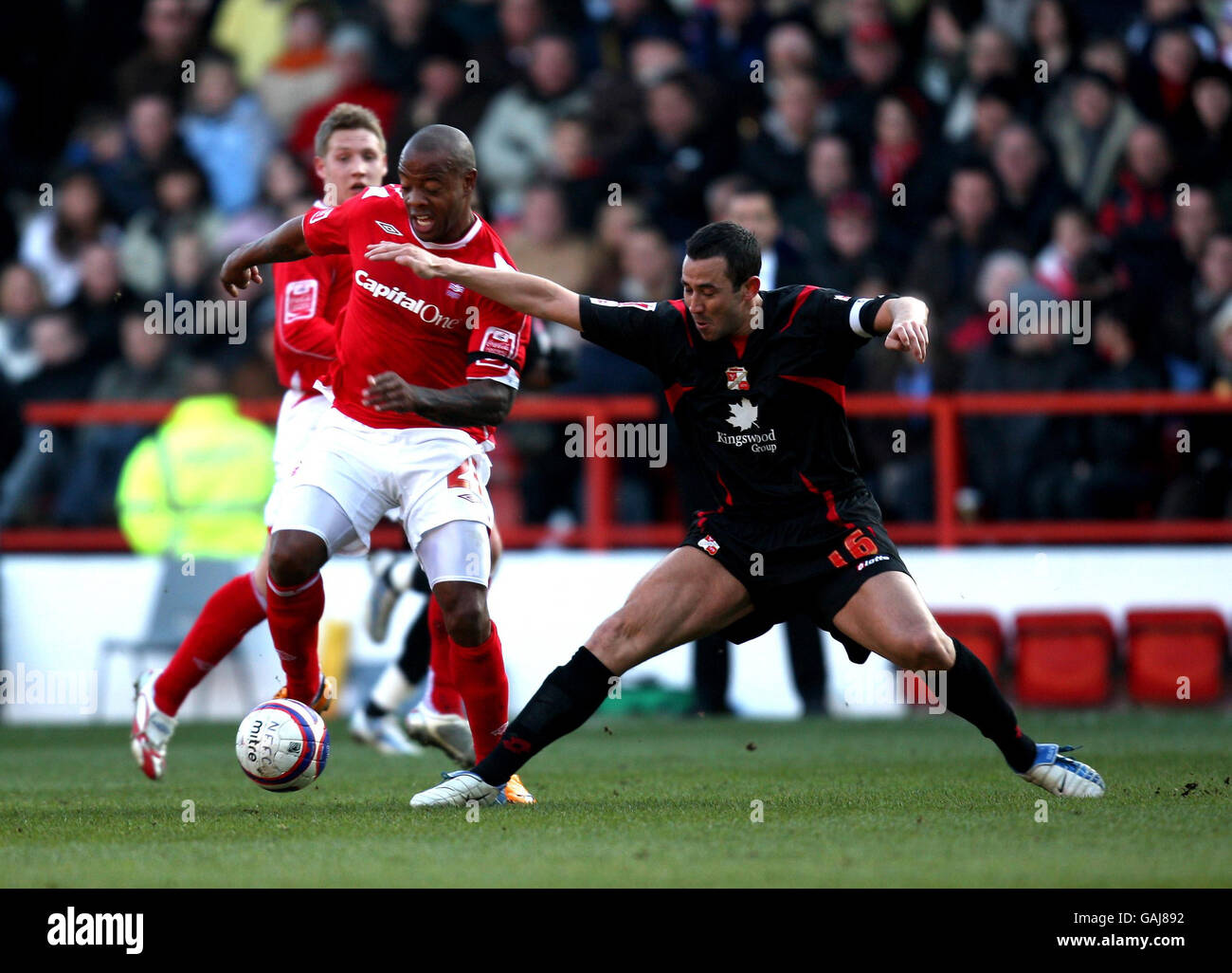 Nottingham Forest's Junior Agogo and Swindon Town's Hasney Aljofree during the Coca-Cola League One match at the City Ground, Nottingham. Stock Photo