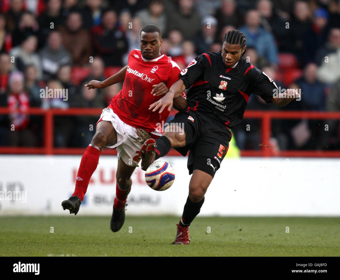 Nottingham Forest's Emile Sinclair and Swindon Town's Jerel Ifil during the Coca-Cola League One match at the City Ground, Nottingham. Stock Photo