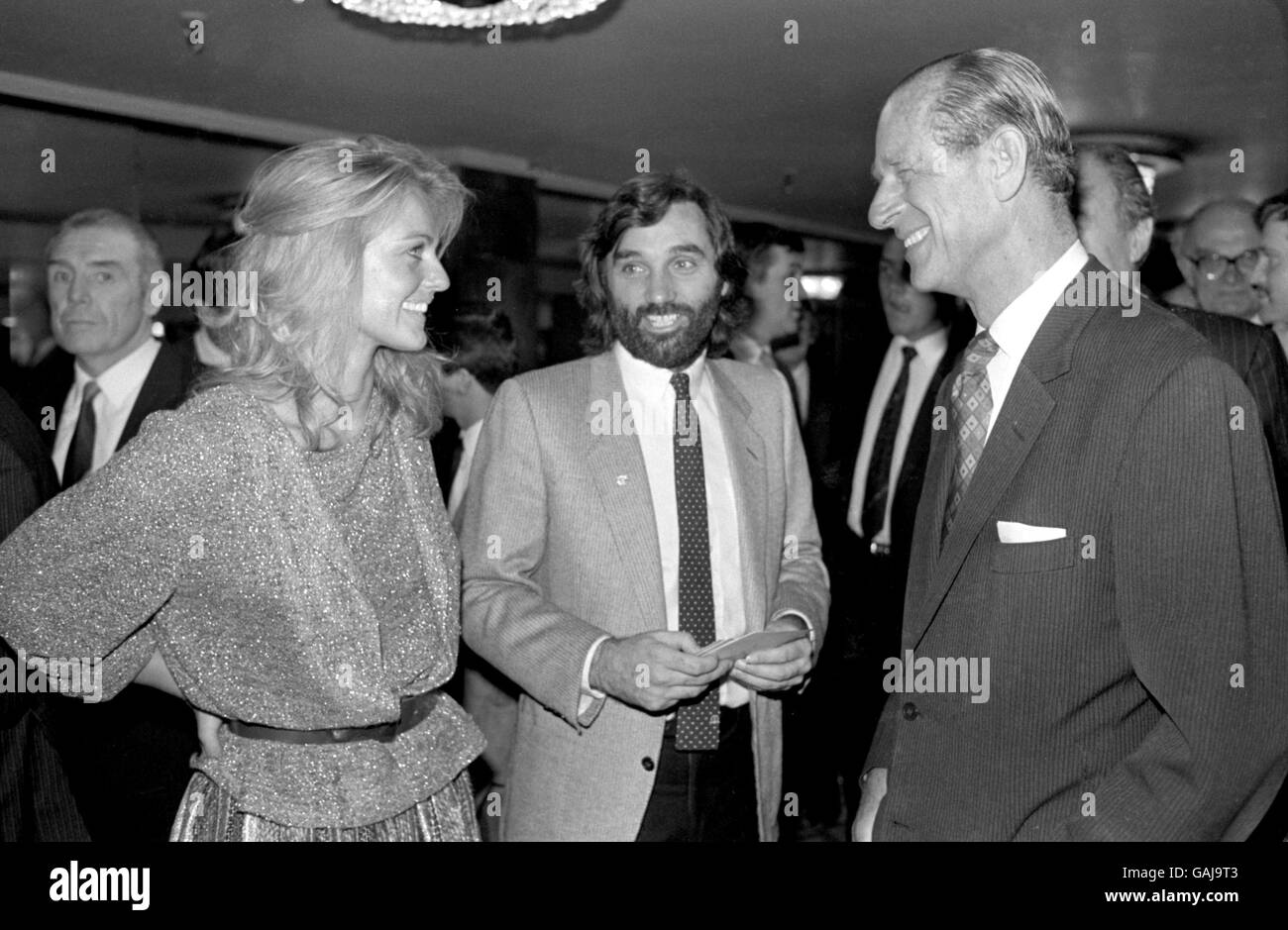 George Best (c) and his girlfriend, former Miss World Mary Stavins (l), chat to HRH The Duke of Edinburgh (r) at the Variety Club National Sponsored Sport Luncheon, held at the Grosvenor House Hotel in London Stock Photo