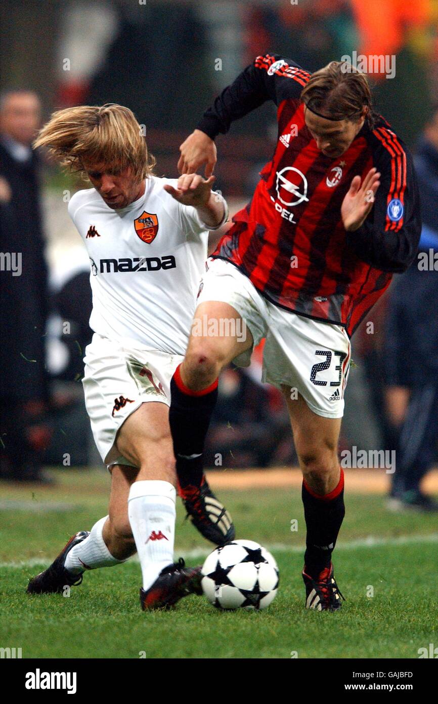 Soccer - Italian Serie A - AC Milan v Roma. AC Milan's Massimo Ambrosini tackled by Roma's Antonio Cassano Stock Photo