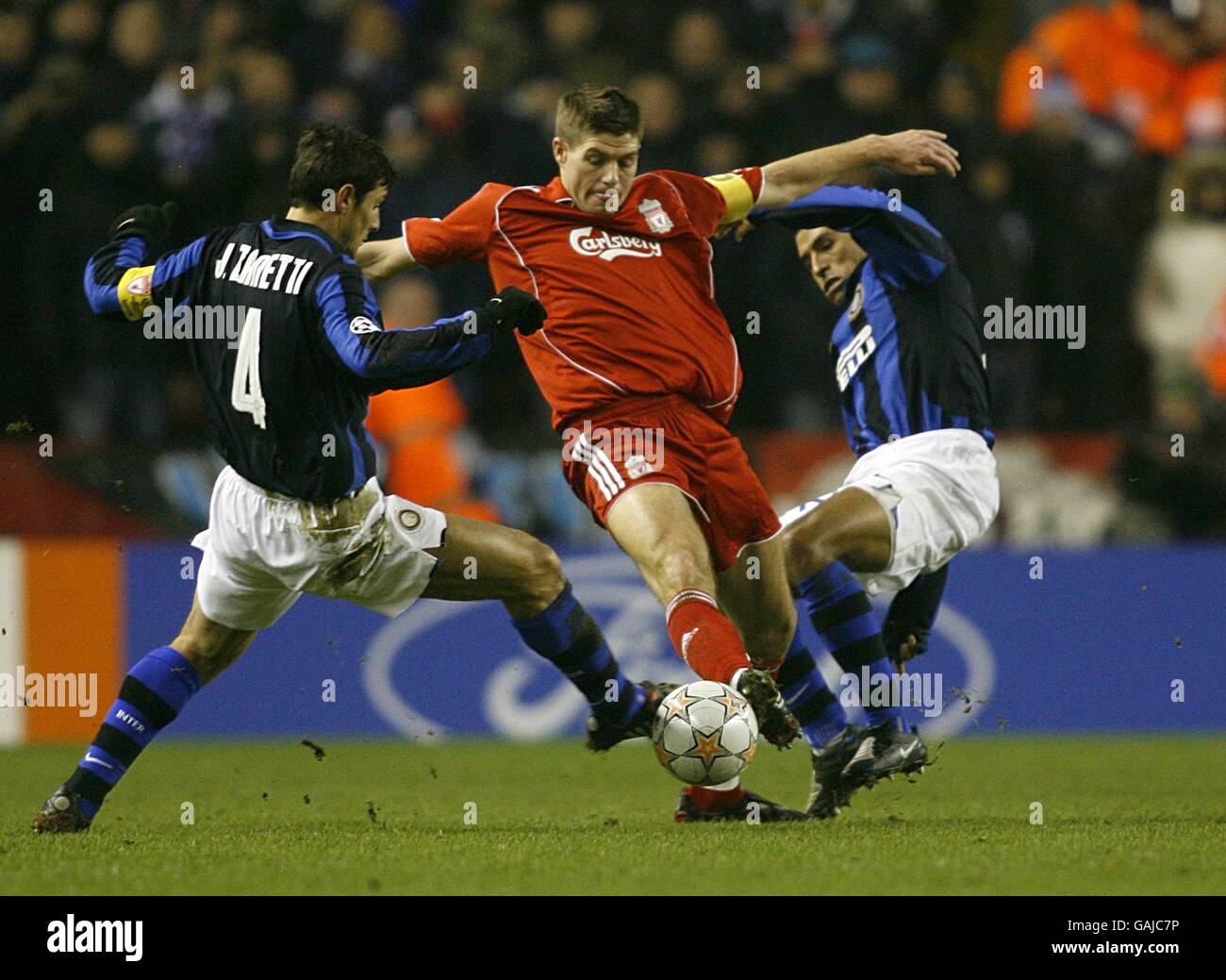 Liverpool's Steven Gerrard battles for the ball with Inter Milan's Javier Zanetti (l) and Ivan Ramiro Cordoba (r). Stock Photo
