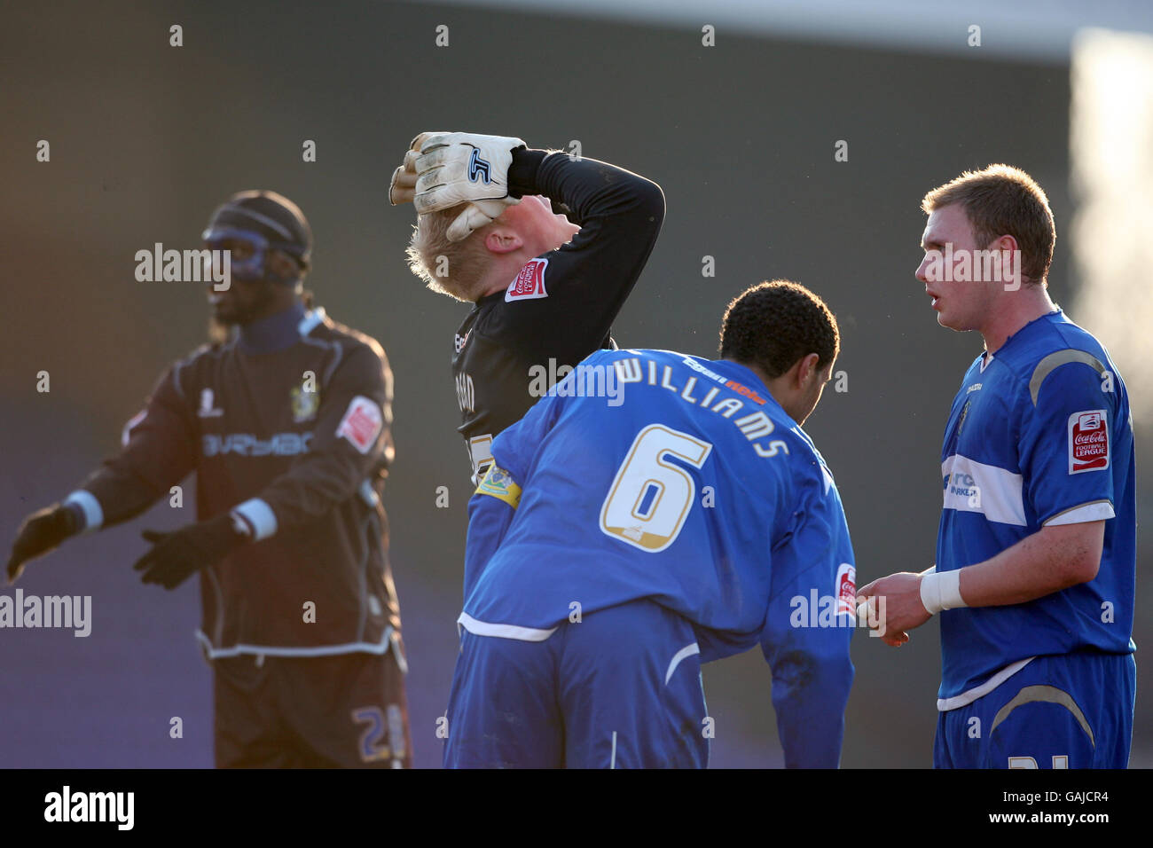 Stockport County goalkeeper Conrad Logan puts his hands on his head