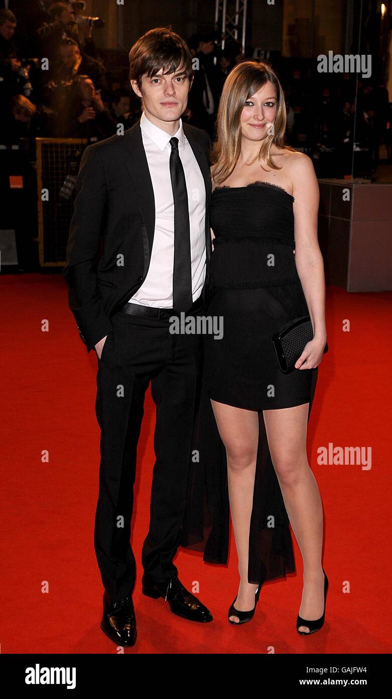 Romanian born actress Alexandra Maria Lara and British actor Sam Riley arrives for the 2008 Orange British Academy Film Awards (BAFTAs) at the Royal Opera House in Covent Garden, central London. Stock Photo