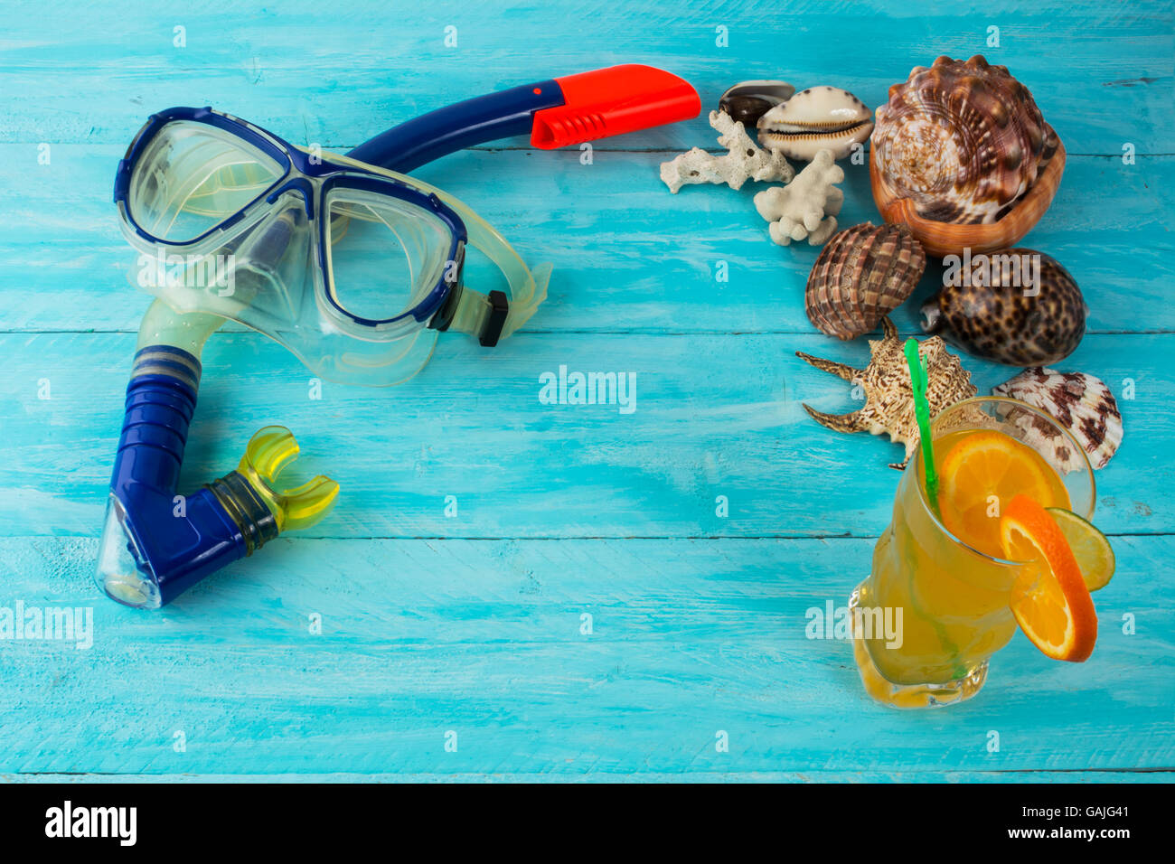 Beach cocktail holidays background. Beach party. Sea shells. Adventure. Snorkeling mask. Diving mask. Watersport. Sea vacation. Stock Photo