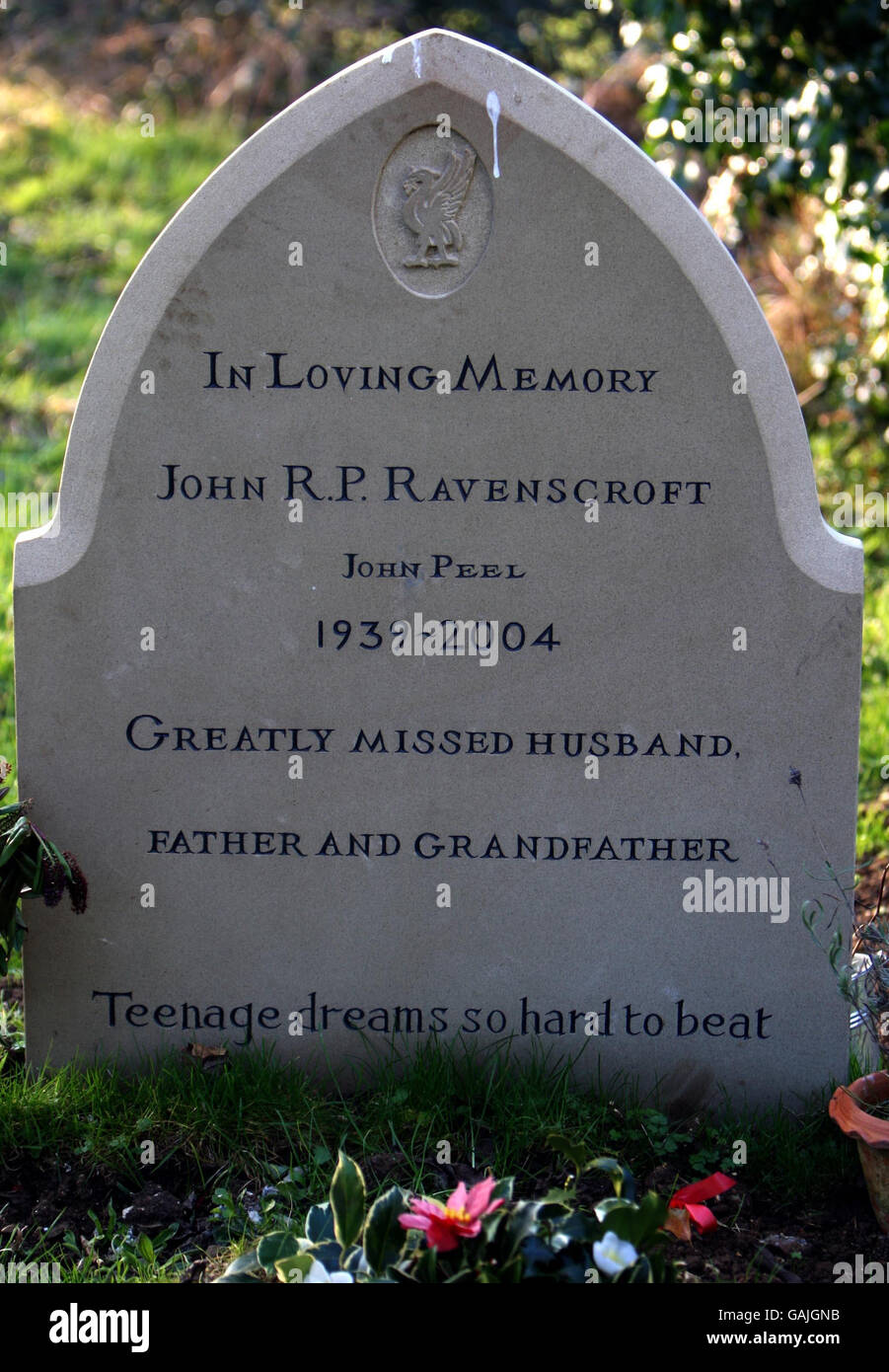 The headstone of legendary DJ John Peel recently erected and engraved with the song lyric 'Teenage dreams so hard to beat' from the Undertones 1978 hit Teenage Kicks, in the grave yard of St Andrews Church, in Great Finborough, near his former home in Suffolk. Stock Photo