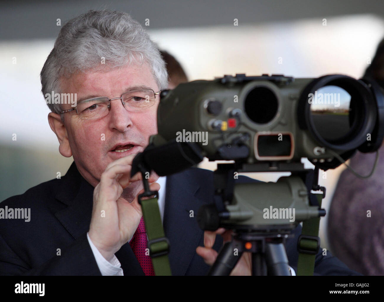 Defence Secretary Des Browne looks through 'laser eyes' during a visit to Thales UK, in Glasgow, where he unveiled the start-of-of-the-art equipment. Stock Photo