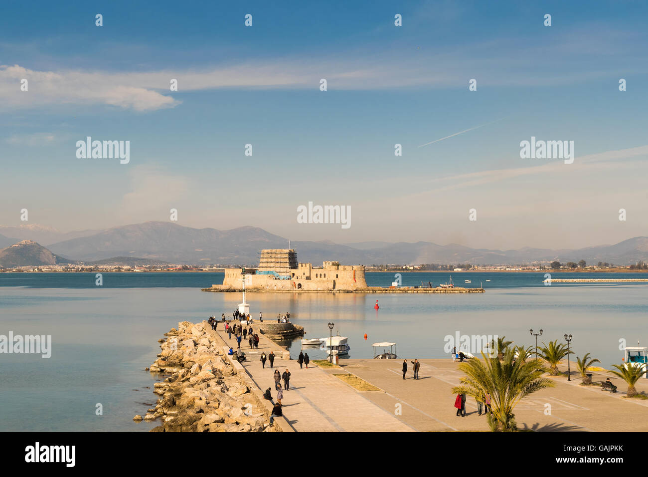Athens, Greece, 27 December 2015. Life at Nafplio in Greece with the old castle bourtzi and the sky as background. Stock Photo