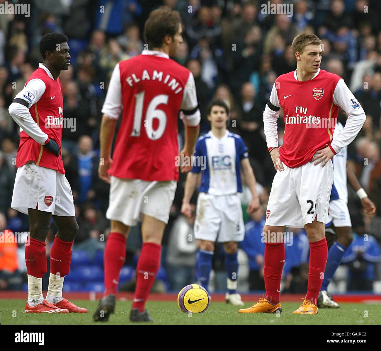 Arsenal's (l-r) Emmanuel Adebayor, Mathieu Flamini and Nicklas Bendtner stand dejected following Birmingham City's James McFadden's penalty equalizer Stock Photo