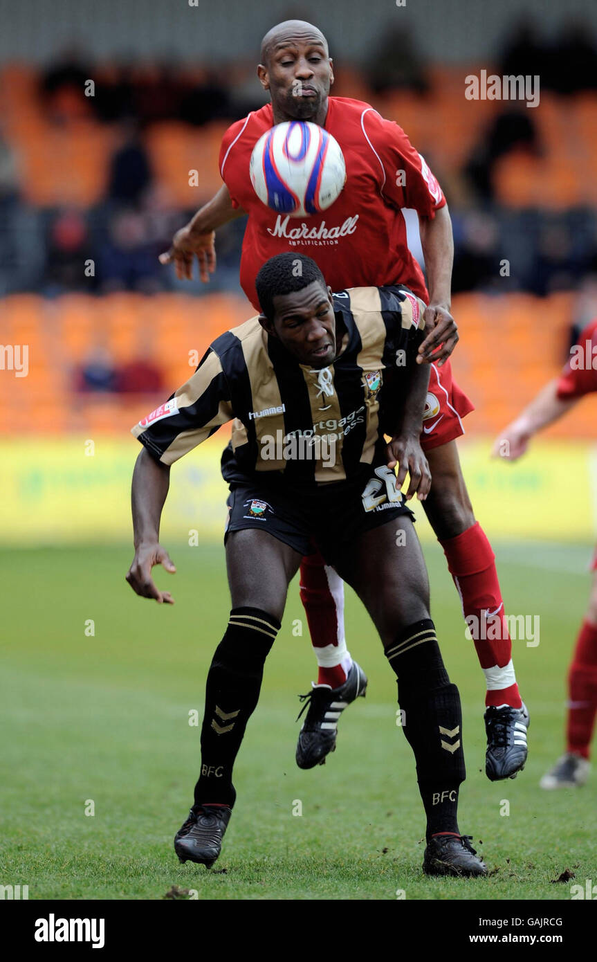 Barnet's Cliff Akurang and Milton Keynes Dons' Drissa Diallo in action during the Coca-Cola Football League Two match at the Underhill Stadium, Barnet. Stock Photo