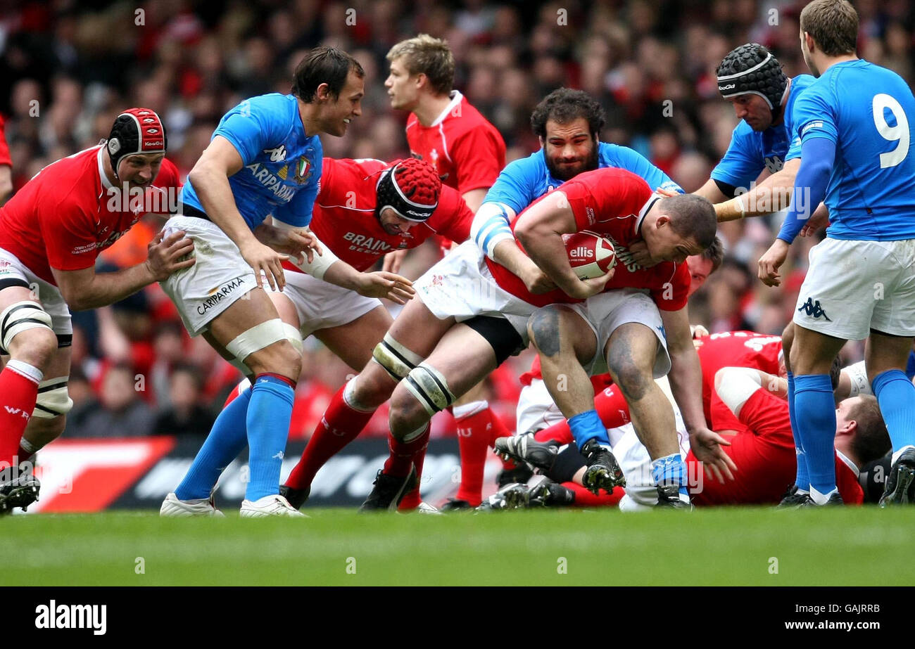 Wales' Ian Evans is tackled by Italy's Martin Castrogiovanni during the RBS 6 Nations match at the Millennium Stadium, Cardiff. Stock Photo