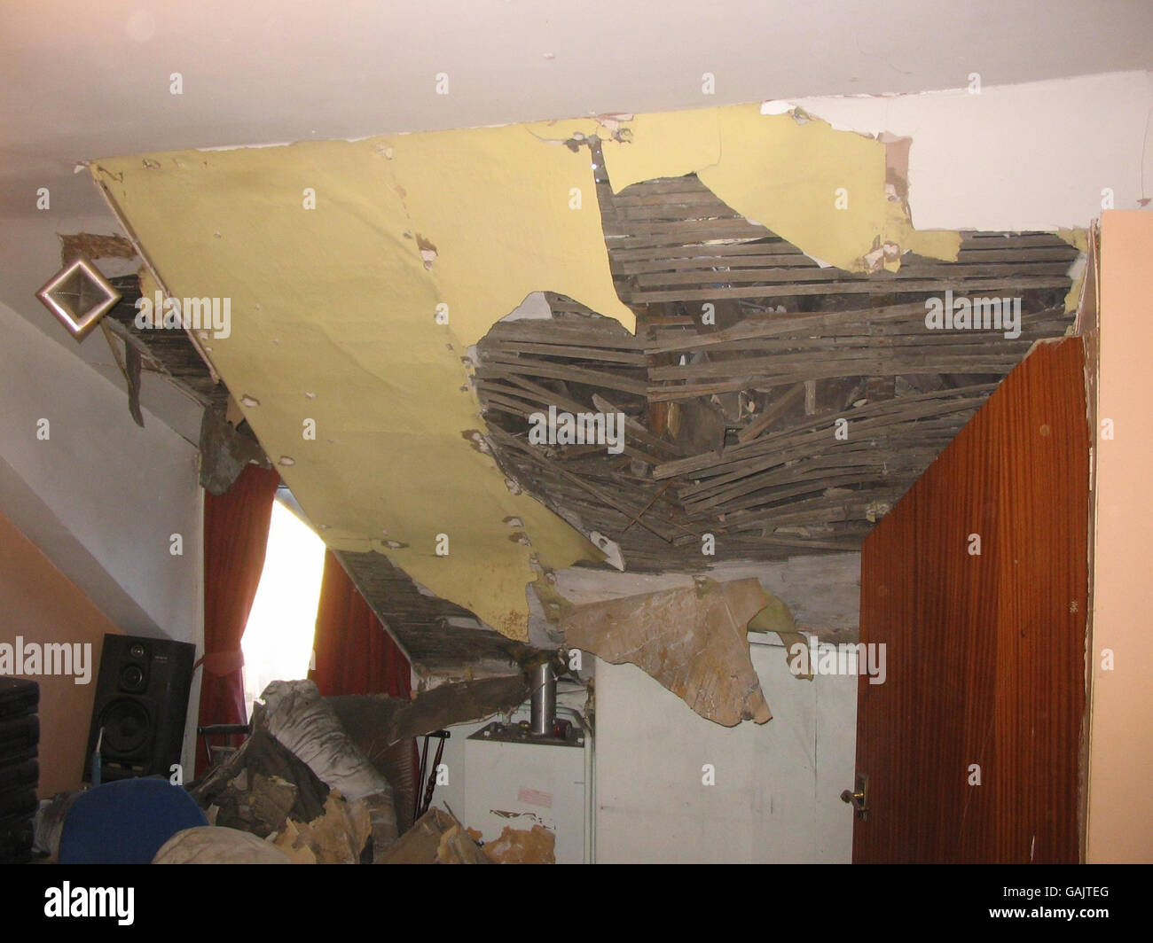 Damage done to the attic of Kleber Afonso's house in Wombwell, Barnsley after earthquake with a magnitude of 5.2 (ML) on the Richter scale near Market Rasen, Lincolnshire at 00:56 GMT. Stock Photo