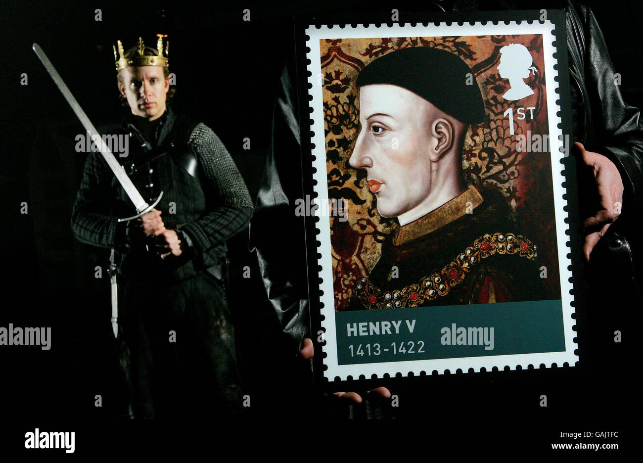 Actor Geoffrey Streatfeild who plays Henry V in the Royal Shakespeare Company's latest production of 'The Histories' with one of the 1st Class Stamps from the Royal Mail's new stamp series, the 'Houses of Lancaster and York'. Stock Photo