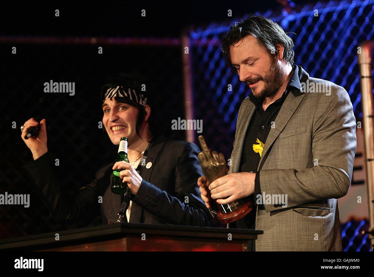 Julian Barratt and Noel Fielding (left) on stage with the Award for Best TV Show received for The Mighty Boosh during the Shockwaves NME Awards 2008 at The O2 Arena, Millennium Way, Greenwich, SE10. Stock Photo