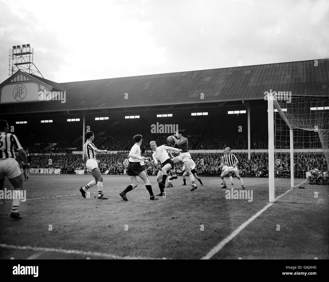 West Bromwich Albion goalkeeper Ray Potter (second r) claims a cross in a crowded goalmouth, beating Tottenham Hotspur's Frank Saul (third r) to the ball Stock Photo