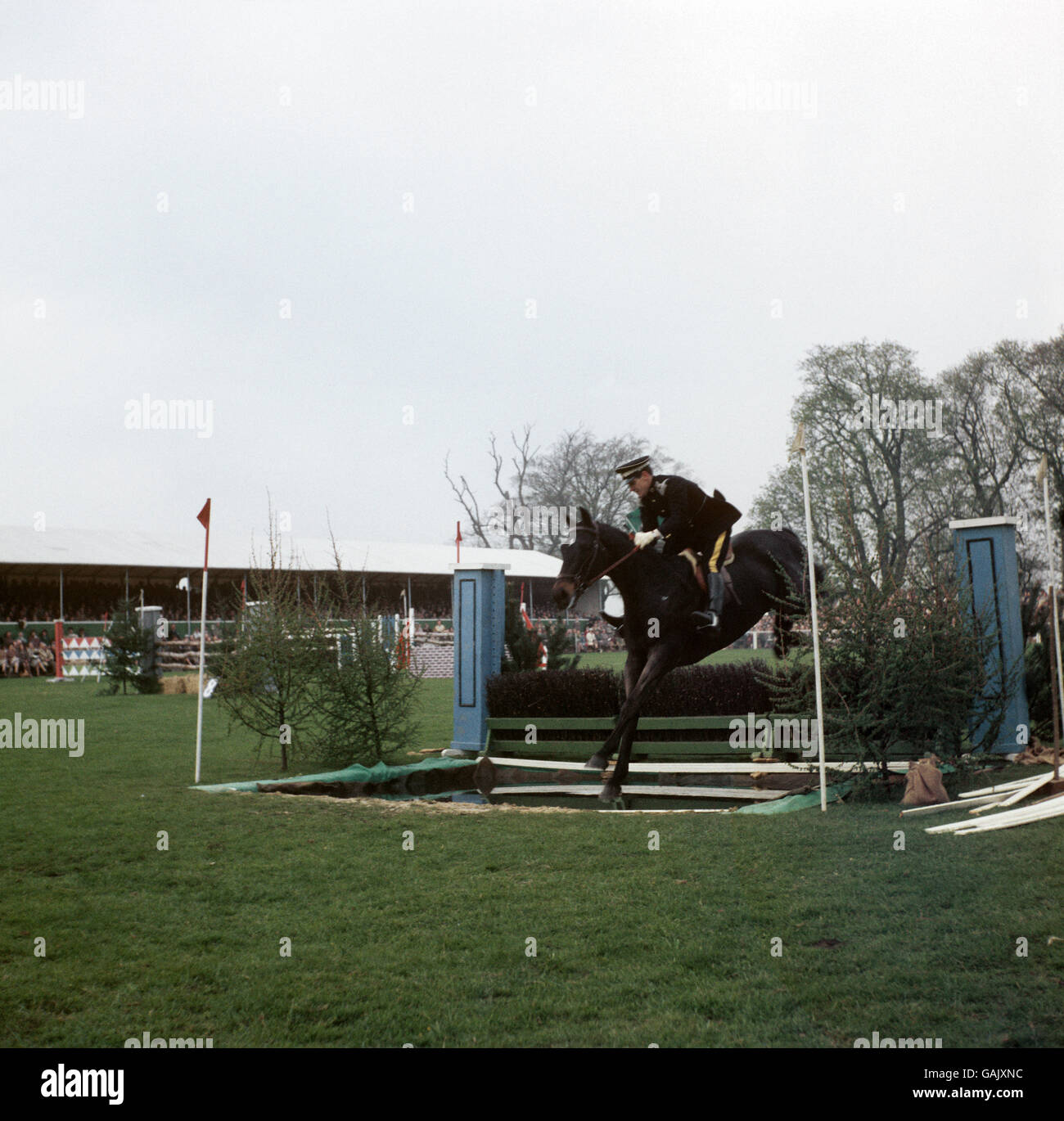 Equestrian - Badminton Horse Trials. Captain J.N.S Arthur takes the water jump on 'Frigorifico' owned by Colonel V.D.S Williams. Stock Photo