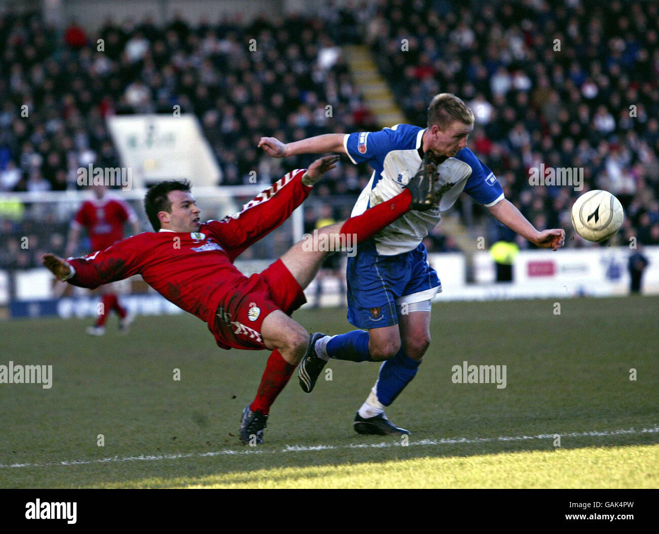 Soccer - Scottish Cup - Quarter Final - St Johnstone v St Mirren - McDiarmid Park. St Johnstone's Andy Jackson is hit by St Mirren's Ian Maxwell during the Scottish Cup Quarter Final match at McDiarmid Park, Perth. Stock Photo