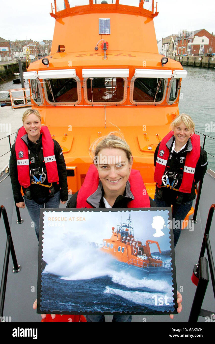 Photo dated 06/03/08 of Great Britain Olympic Sailing Team members Sarah Webb (front), Pippa Wilson (left), and Sarah Ayton (right) aboard RNIB all-weather lifeboat Ernest & Mable 17-32, at Weymouth Lifeboat Station, Dorset. Stock Photo