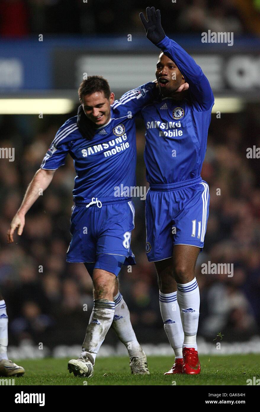 Soccer - Barclays Premier League - Chelsea v Derby - Stamford Bridge. Chelsea's Frank Lampard (left) celebrates with team mate Didier Drogba after scoring the sixth goal goal of the game. Stock Photo