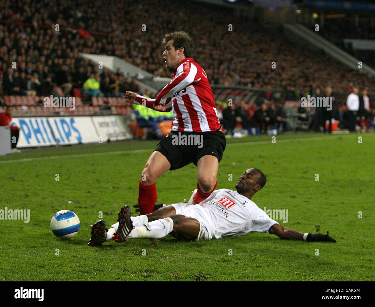 Soccer - UEFA Cup - Round Of 16 - Second Leg - PSV Eindhoven v Tottenham Hotspur - Philips Stadion. Tottenham Hotspurs' Didier Zokora fouls PSV's Danko Lazovic which earns him a yellow card Stock Photo