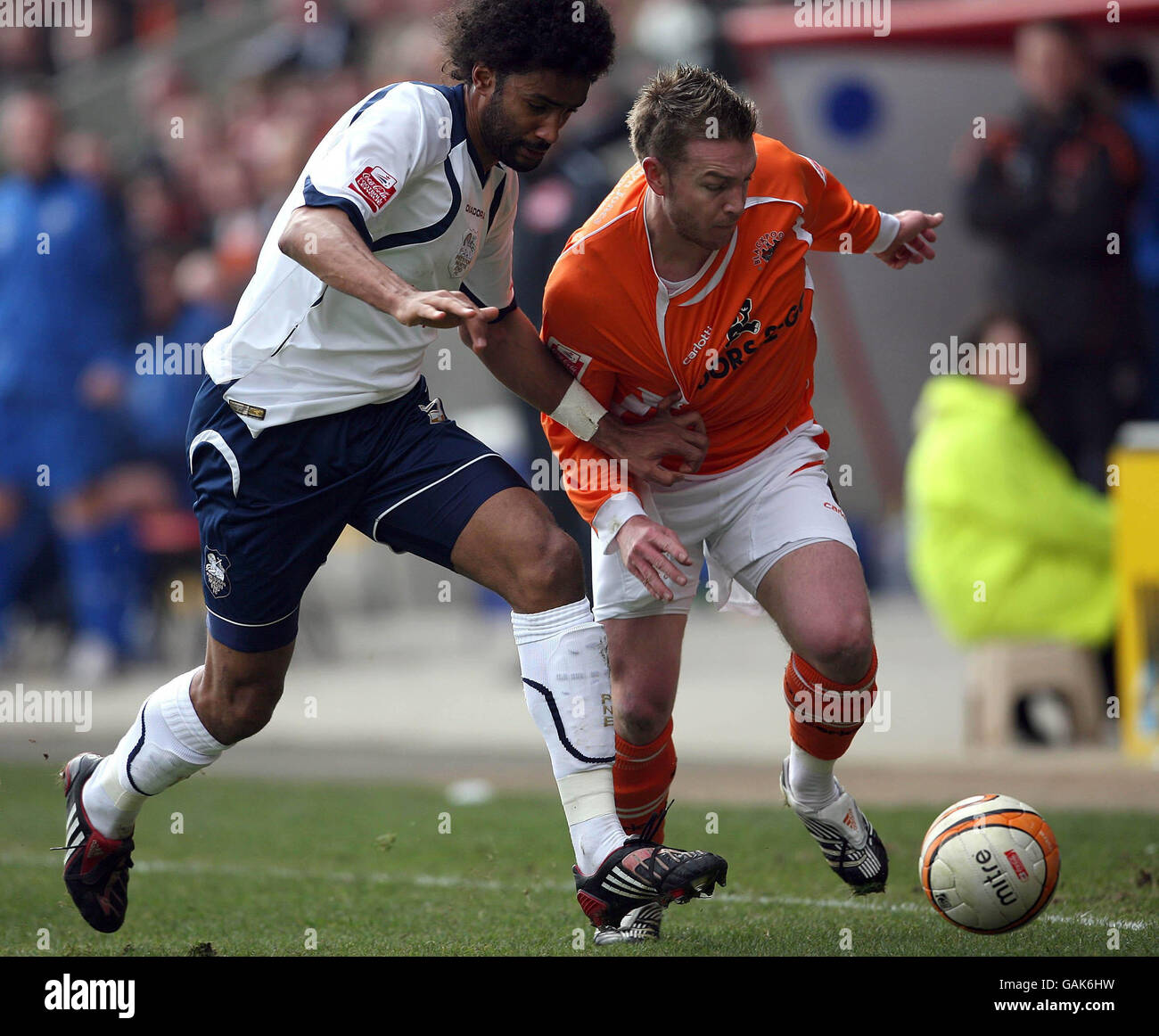 Blackpool's Stephen McPhee (r) and Preston's Youl Mawene battle for the ball during the Coca-Cola Championship match at Bloomfield Road, Blackpool. Stock Photo