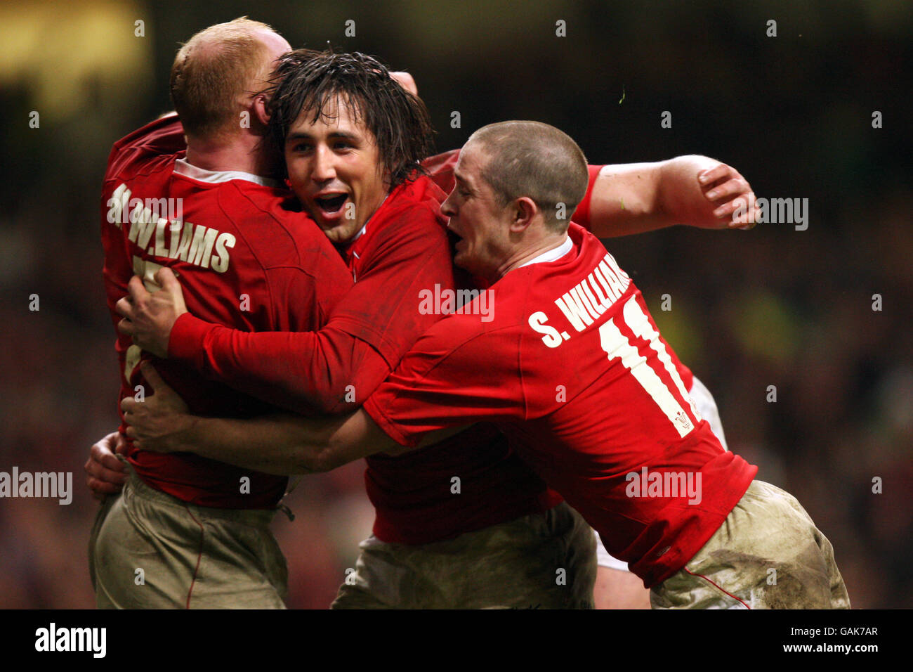 Gavin Henson and Shane Williams congratulate Martyn Williams after scoring Wales second try during the RBS 6 Nations match at the Millennium Stadium, Cardiff. Stock Photo