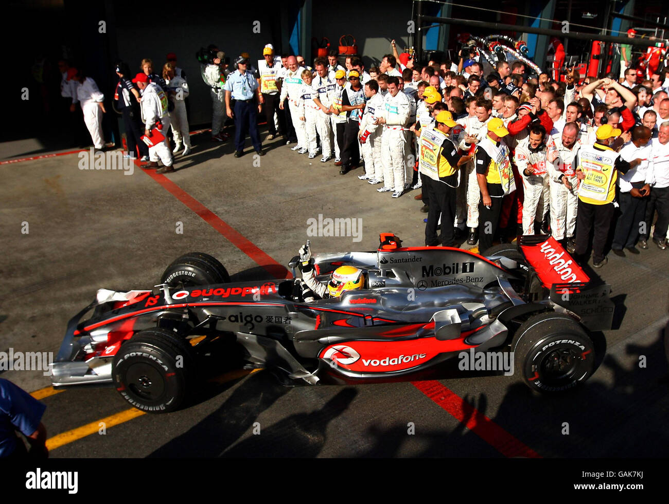 McLaren's Lewis Hamilton celebrates his victory during the Formula One