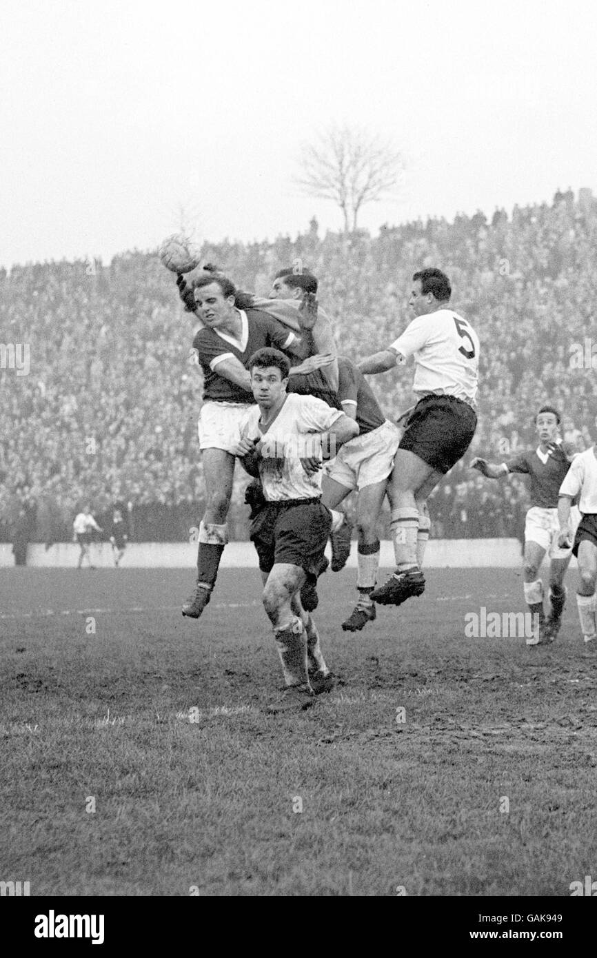 Southampton goalkeeper Ron Reynolds (c, half hidden) reaches over Charlton Athletic's Dennis Edwards (l) to get his hands on the ball Stock Photo