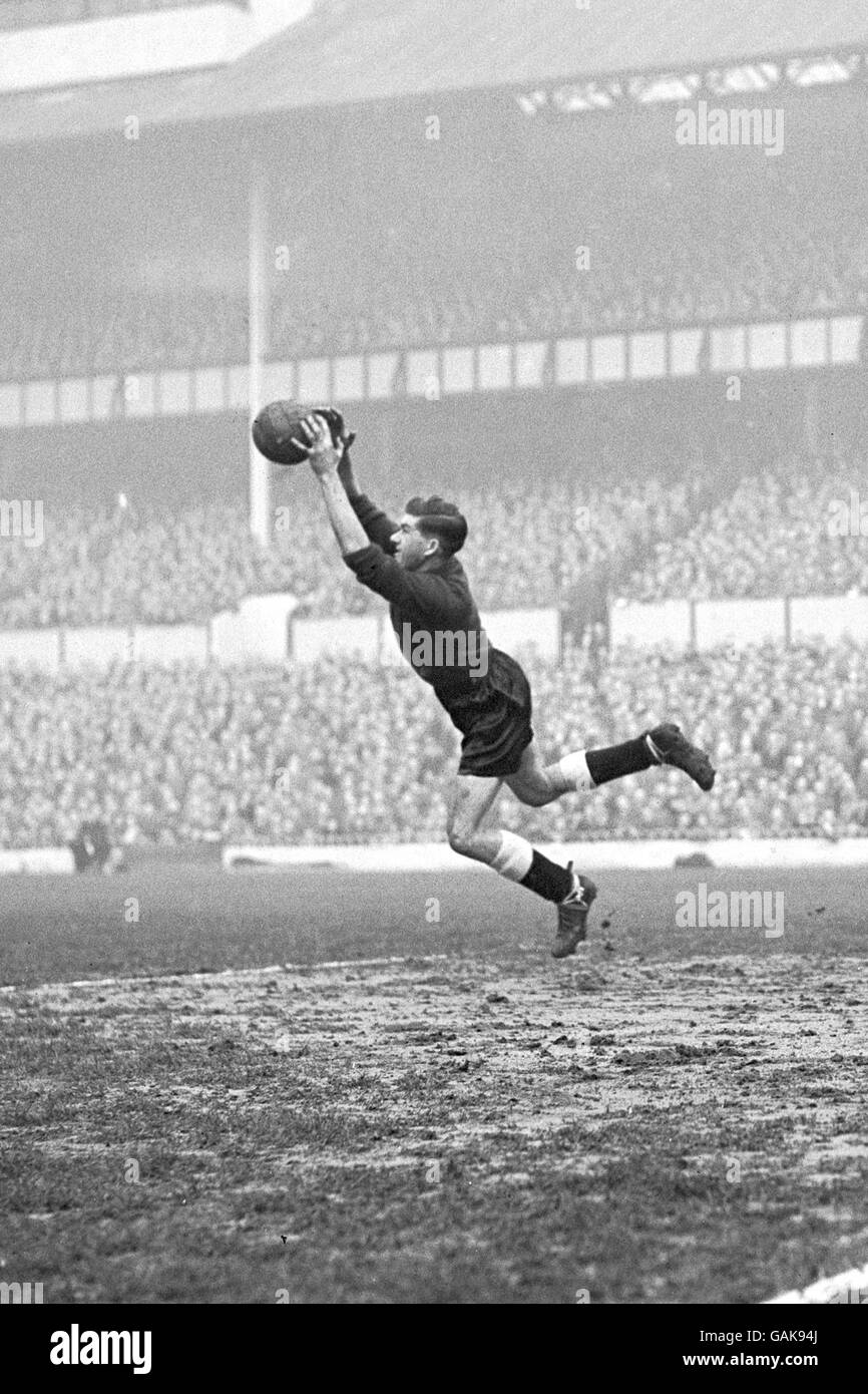 Tottenham Hotspur goalkeeper Ron Reynolds leaps to make a save Stock Photo