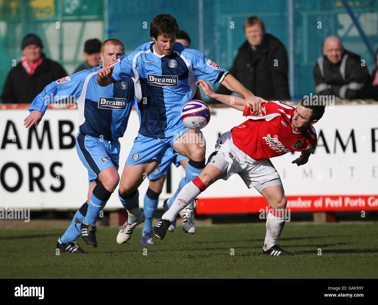 Wycombe Wanderers Mike Williamson and Morecambe's Gary Hunter during the Coca-Cola League Two match at Christie Park, Morecambe. Stock Photo