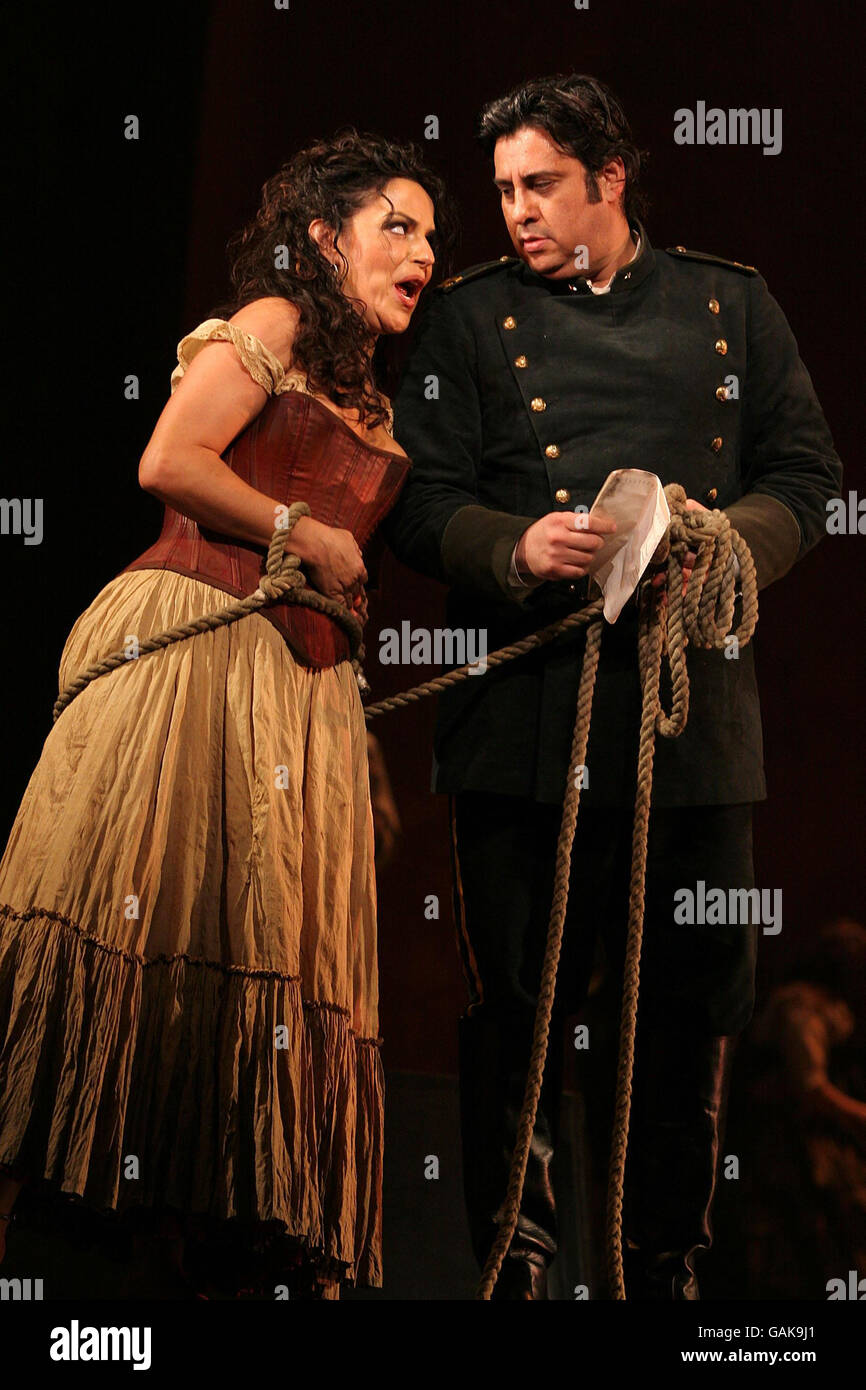 The cast of Carmen including Nancy Fabiola Herrera (left) and Marcelo Alvarez (right), perform onstage at the Royal Opera House in Covent Garden, central London. Stock Photo