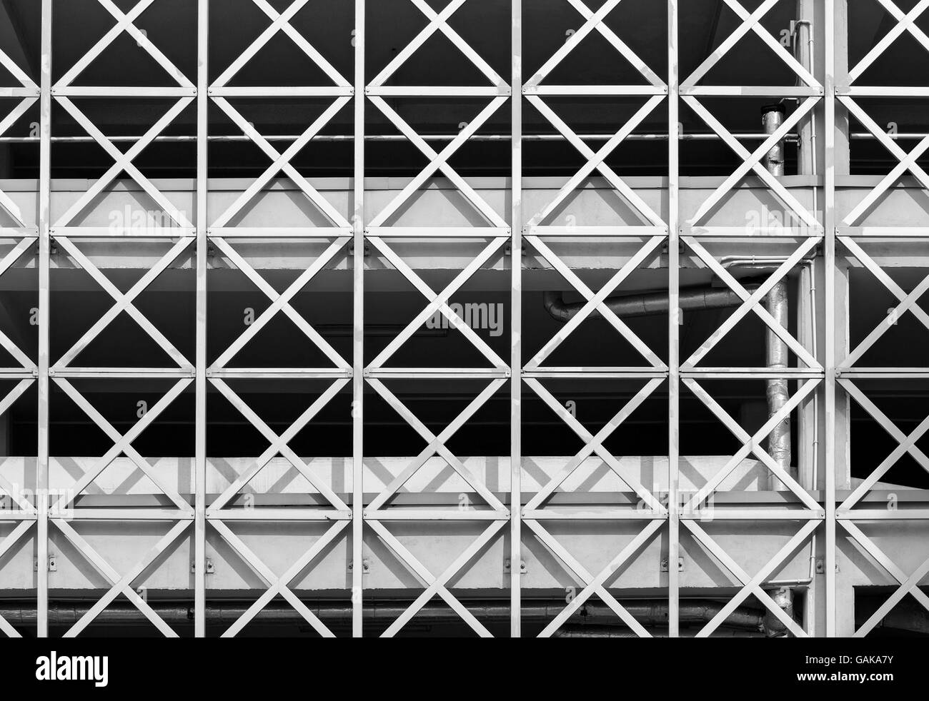 Metal grid on facade of modern industrial building Stock Photo