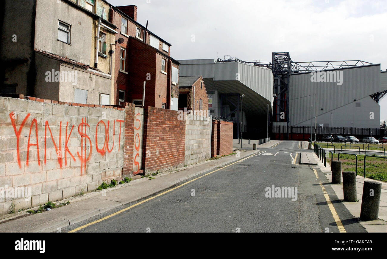 Graffitti near Liverpool football club's stadium displaying the fans unrest at the club's American ownership. Stock Photo