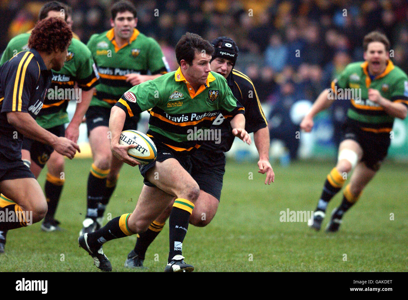 Northampton saints james brooks burst through for a try hires stock