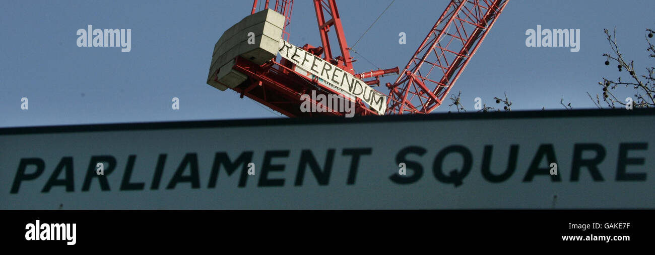 A banner unfurled by demonstrators on top of a crane in Parliament Square, London, in an apparent protest over the EU Treaty. Stock Photo