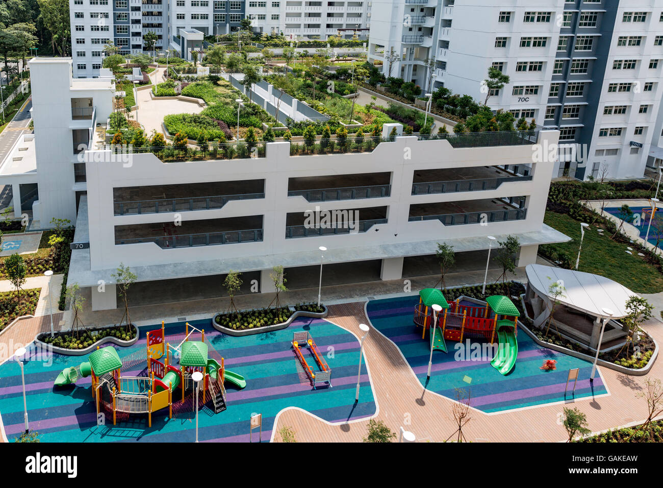 Roof top garden and children's playground in new Singapore public housing (Housing Development Board) apartment blocks. Stock Photo
