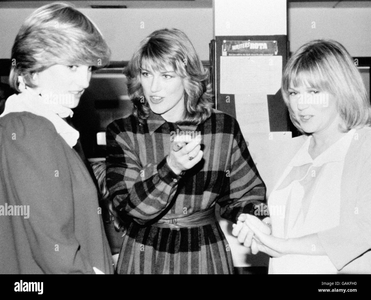 The Princess of Wales, who was expecting her first baby in June, dicussing with Selina Scott (centre) and Carol Barnes the running order for News at 5.45 during her visit to the London Offices of ITN. Carol presented the programme, which the princess watched from the control room. Stock Photo