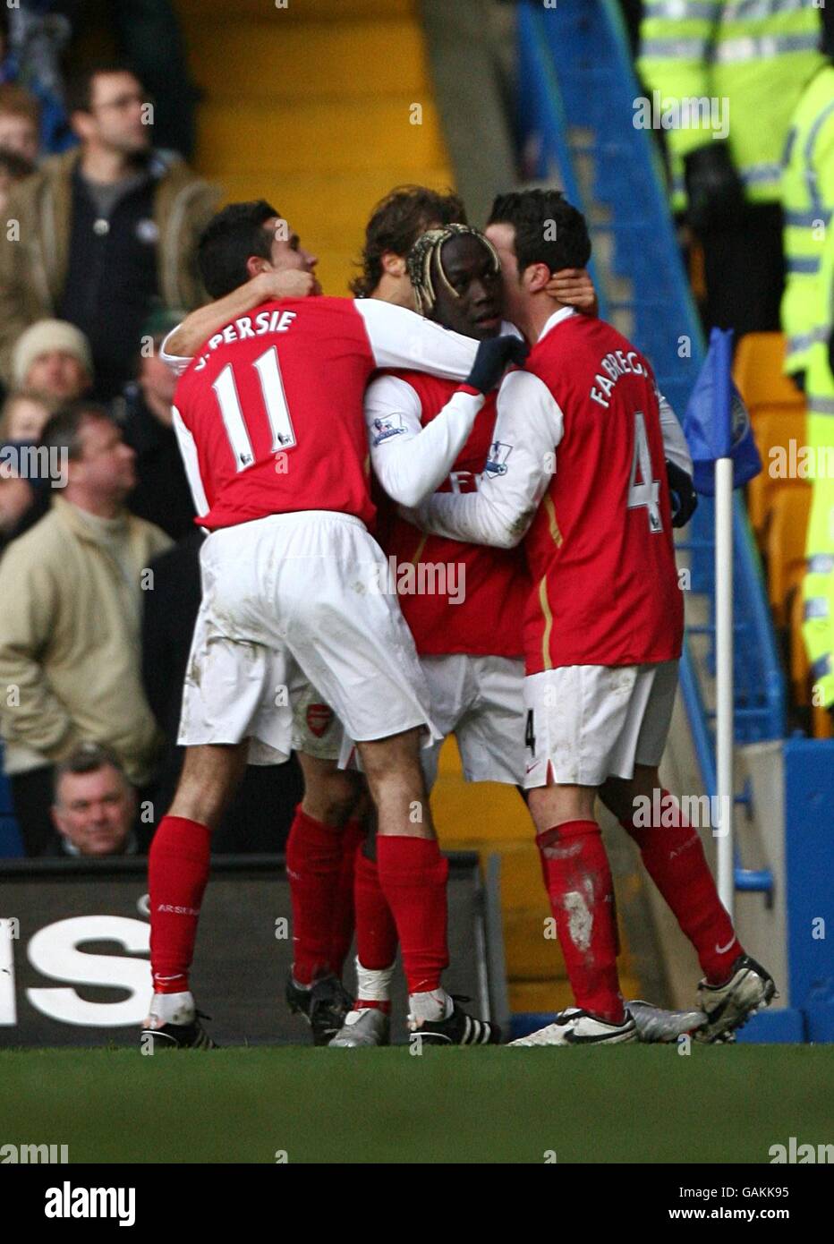 Arsenal's Bacary Sagna (center) celebrates scoring his sides first goal of the game with teammates Stock Photo