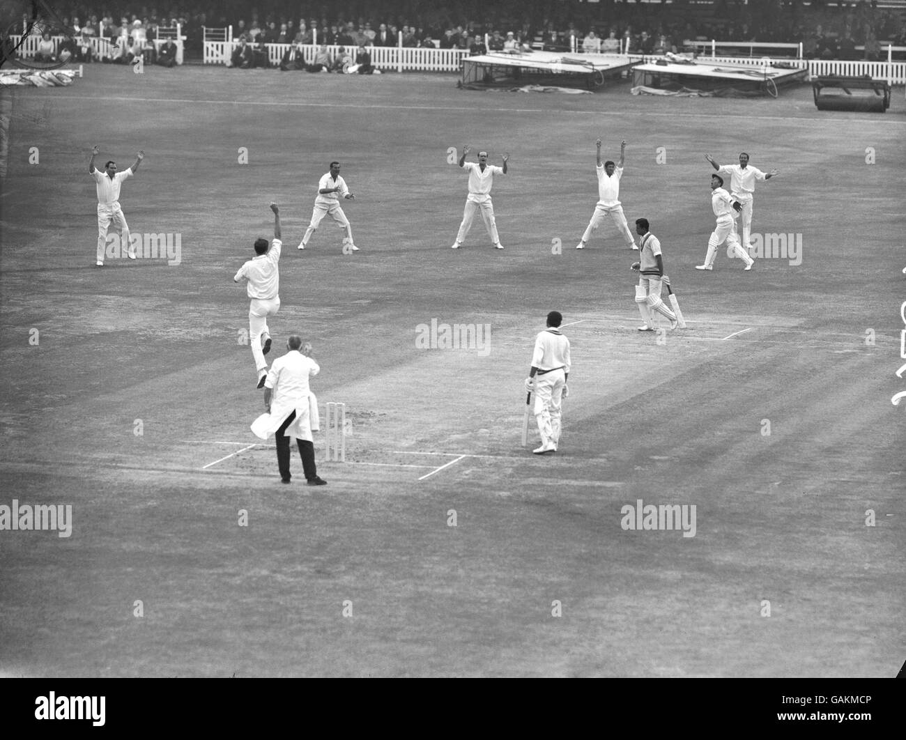 India's Venkataraman Subramanya (third r) begins the walk back to the pavilion after being caught behind by England wicketkeeper John Murray (second r) off the bowling of Doug Brown (second l). Other England players are (l-r) Ray Illingworth, Tom Graveney, Brian Close, Ken Barrington and Basil D'Oliveira Stock Photo