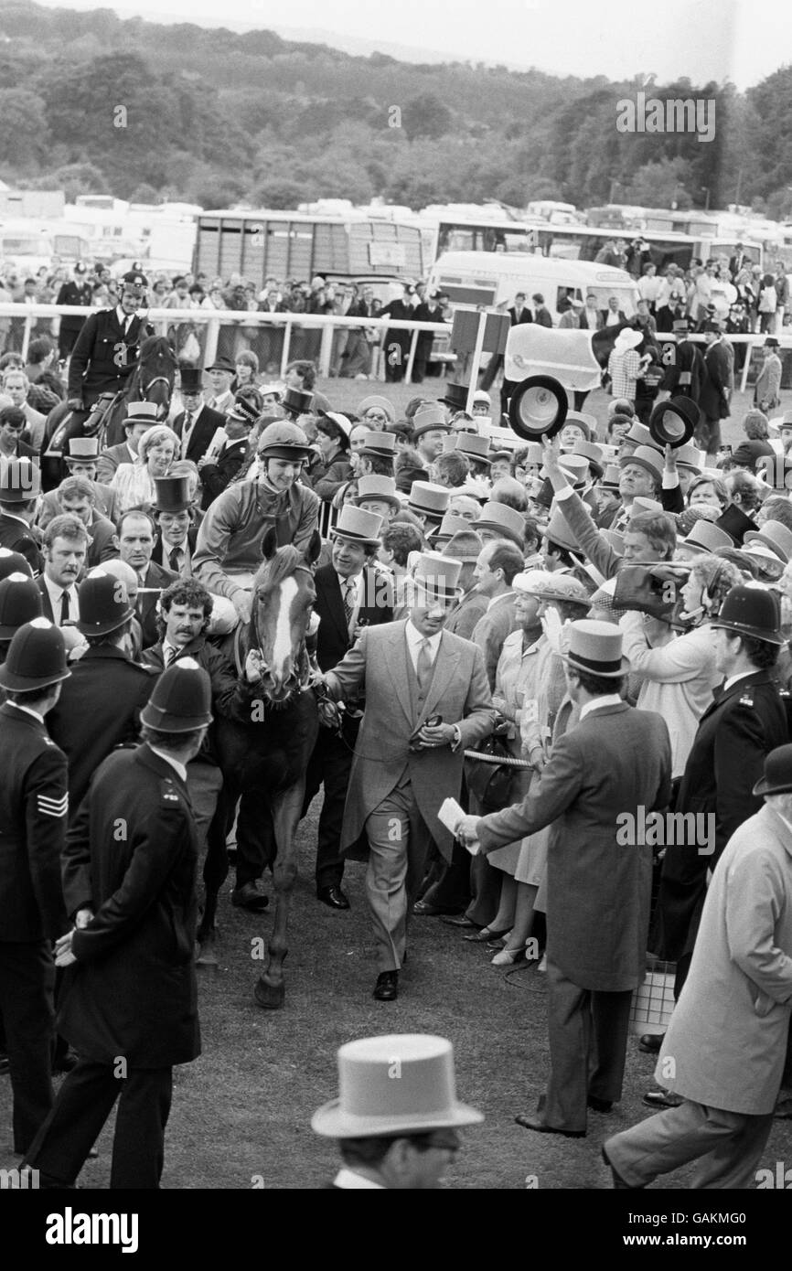 The Aga Khan leads his Nijinsky chestnut colt Shahrastani into the winners enclosure with jockey Walter Swinburne aboard after landing the honours in the 207th Derby at Epsom. Second was Dancing Brave with Mashkour third. Stock Photo