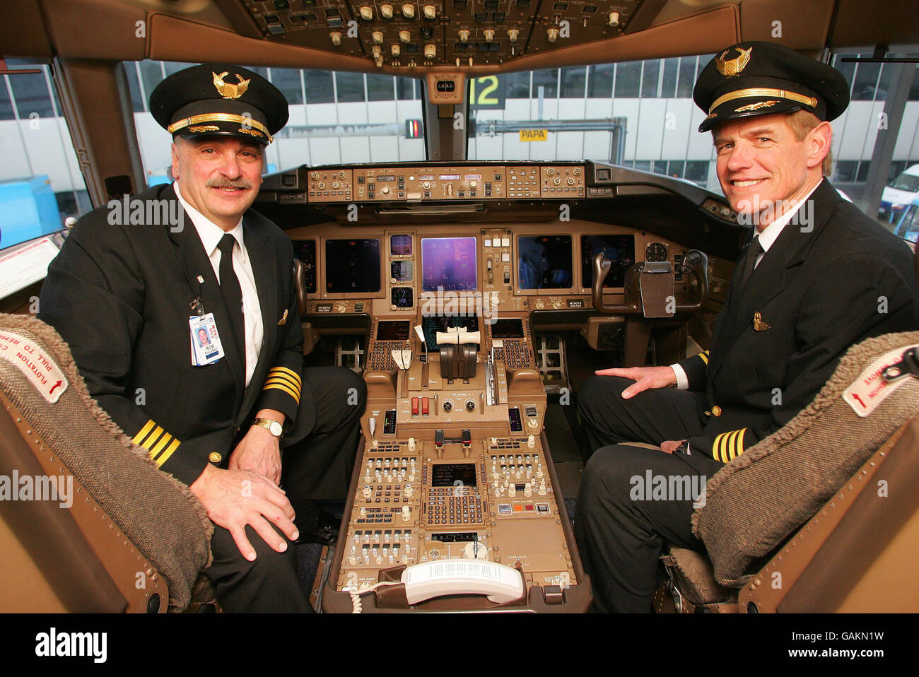 Captain Rob Pulino, left, and First Officer TJ Mearsheimer on the flight deck of Continental Airlines flight CO28 after it arrived at London's Heathrow Airport from New York this morning, making it the first plane to land at Heathrow under the new Open Skies agreement between the US and the European Union. Stock Photo
