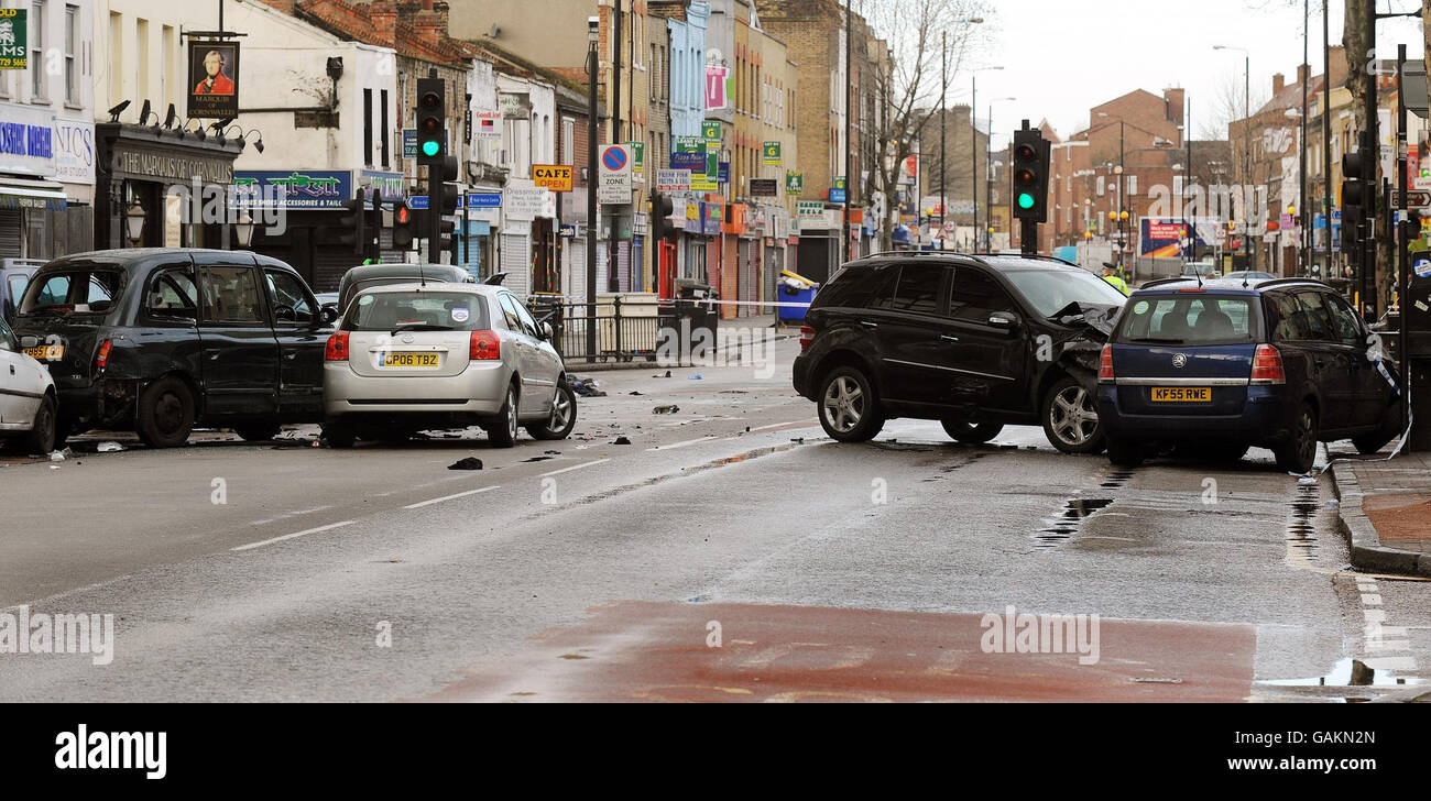 The scene in Bethnal Green Road, east London, after a black Mercedes four-wheel drive jeep being pursued by a police car crashed into several cars causing a fatal accident in the early hours of this morning. Stock Photo