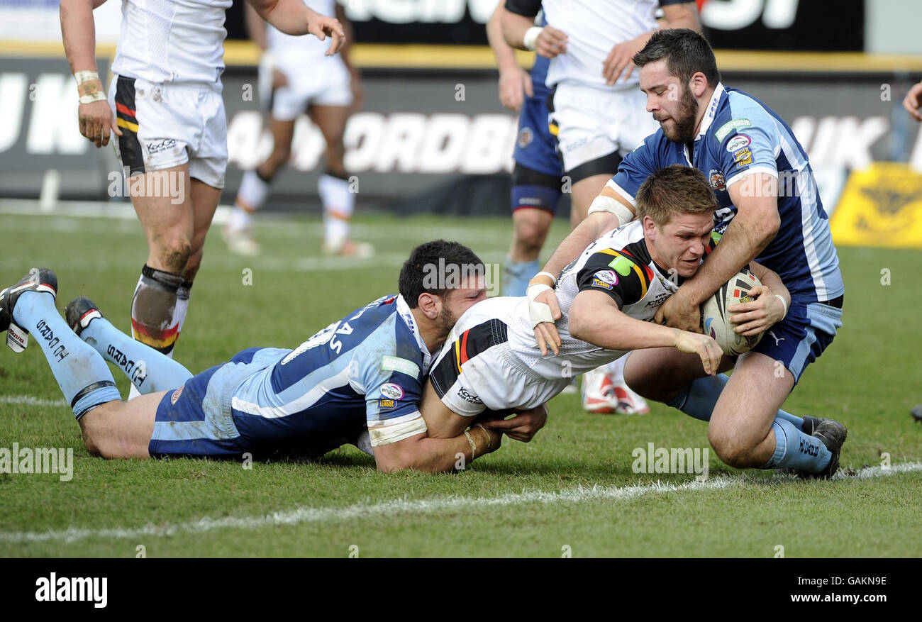 Bradford Bulls' Wayne Godwin goes over to score under pressure from ...